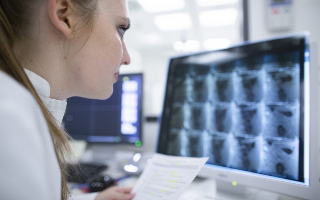 USMS | US Medical Systems | Young doctor in hospital looking at computer screen